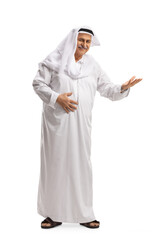 Full length portrait of a mature arab man in a dishdasha gesturing welcome