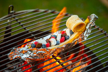 Grilled Banana stuffed with Marshmallow, Chocolate, Raspberries and Blueberries, Vegan Barbecue