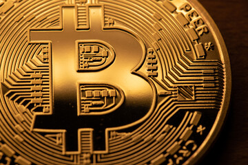 Fototapeta na wymiar Bitcoin coins closeup. Golden Crypto coins. Cryptocurrency and Blockchain concept. Digital Gold