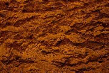 Copper colored wall texture background with textures of different shades of copper or bronze