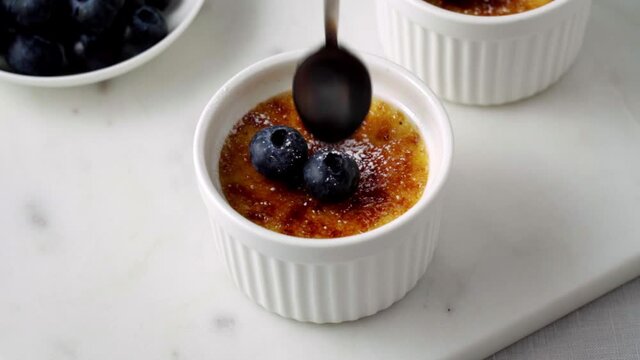 Broken, cracked crust of traditional French vanilla cream dessert. Burned Trinity or Cambridge burnt cream. Spanish crema catalana, rich custard base topped with layer of hardened caramelised sugar.