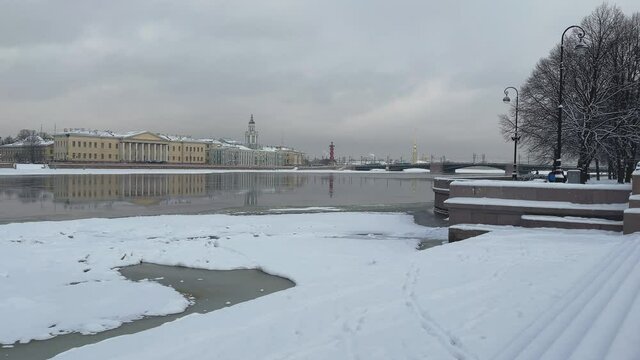 The picturesque winter landscape of the snow-covered embankment of St. Petersburg, Museums of Anthropology and Ethnography of the Russian Academy of Sciences, Palace bridge, Peter and Paul fortress