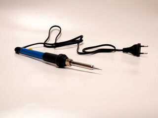 Close up shoot of soldering iron, a tool for soldering electrical components. Shoot on white isolated background