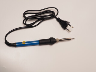 Close up shoot of soldering iron, a tool for soldering electrical components. Shoot on white isolated background