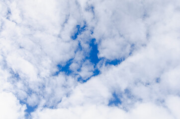 Blue with blue sky with clouds.