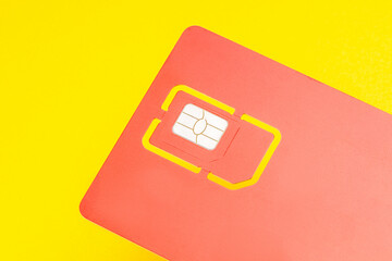 sim card for mobile phone isolated on yellow background. 4G sim card for smartphone cut out