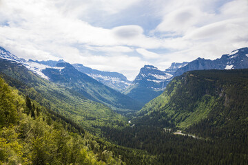 Fototapeta na wymiar Snow covered mountain tops in Glacier National Park, Montana