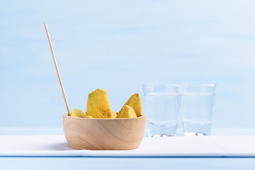 Pickled fruit in a bowl and alcohol drink in summer season