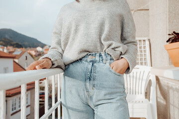 Close up of a woman wearing mom jeans with copy space during a bright day, fashion and styling...