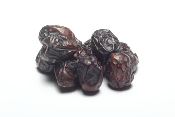 Dates on a white background. Dried fruits. Dried dates lie next to each other	
