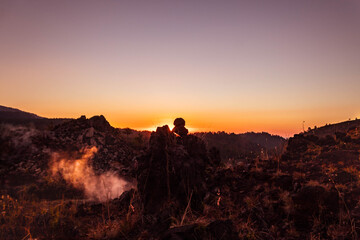 Fototapeta premium Balanced rocks at El Paricutin in the sunset