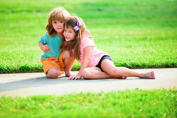 Lovely kids relationships. Couple of children in park. Boy and girl outdoor.