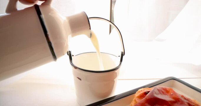 Morning breakfast with freshly baked puffed cheese pie and yogurt milk, 4k video