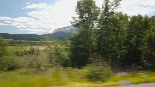 WATERTON, AB, CANADA - JULY 2019: Smooth & cinematic gimbal driving views of Waterton National Park Environment