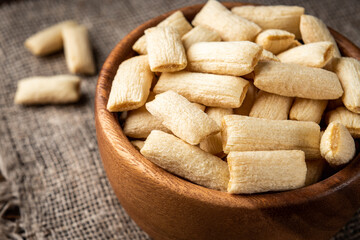 Breakfast dried pads on dark wooden background.