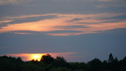 The beautiful sunset view in the city with the colorful clouds sky
