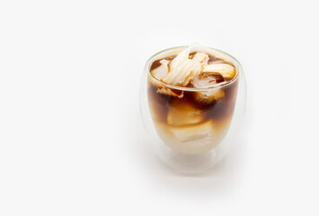 Iced coconut coffee in double walls glass isolated on white background.