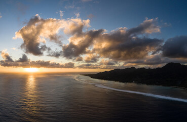Dramatic aerial panorama of the sunset over the Rarotonga island, the main of the Cook islands archipelago in the south Pacific ocean.