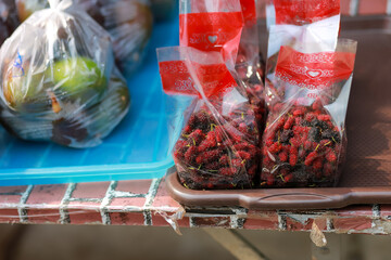 Fresh mulberry in plastic bags sold in rural areas in Thailand looks delicious. Healthy fruit And have a good reputation in medicine