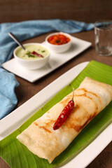 Dosa , Dosai, ghee roast, tomato coconut chutney sambar popular South Indian Breakfast, Kerala, Tamil Nadu India. Top view of Masala dosa Kerala breakfast food. Indian food