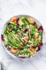 Keto salad with clementines and avocado healthy food