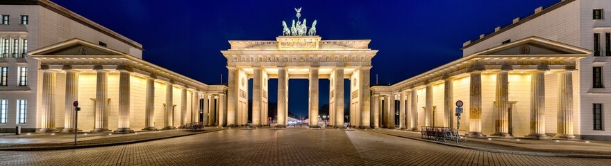 Panorama of the illuminated Brandenburg Gate in Berlin at night - obrazy, fototapety, plakaty