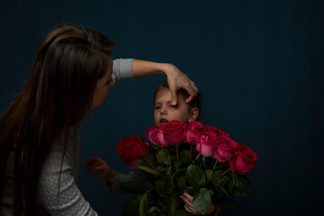 Young woman holding bouquet of roses flowers