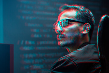 Man analysing binary code on virtual screen in double color exposure effect