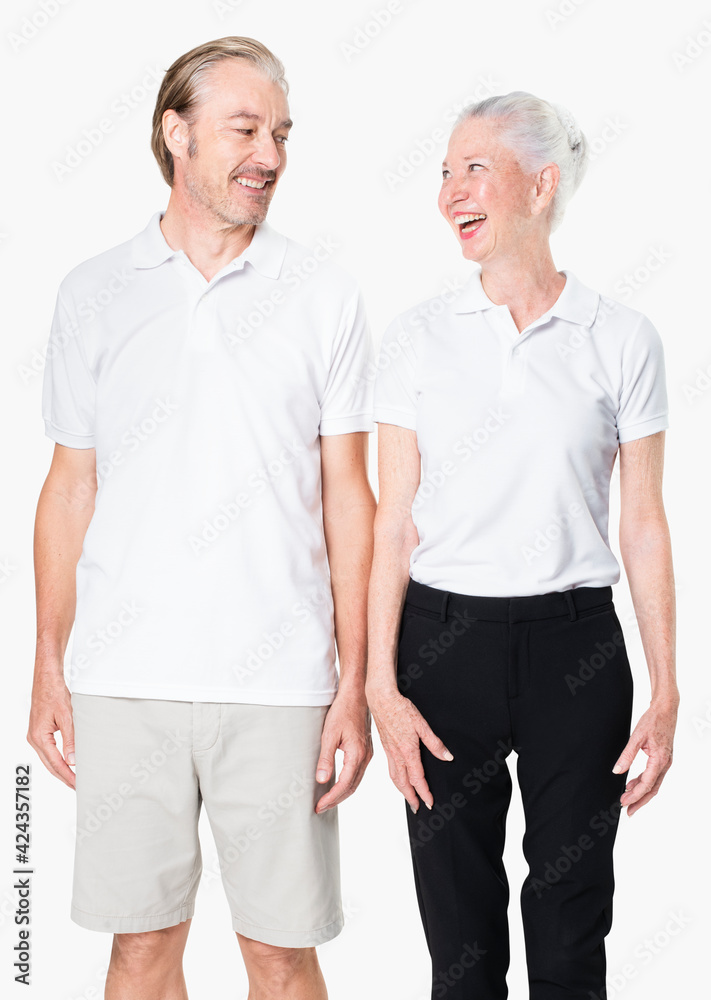 Poster happy senior couple in white polo shirts with design space studio portrait