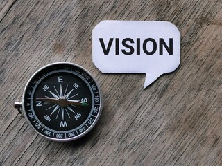 Vision and business concept. Text VISION written on bubble speech with compass.