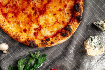 Top view on neopolitan fresh baked margherita pizza on the grey background