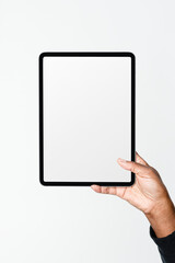 Hand holding digital tablet with blank white screen