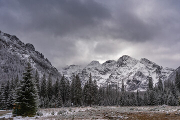 Images on postcards in the form of snow-capped mountain peaks against the background of the lake in the Polish High Tatras