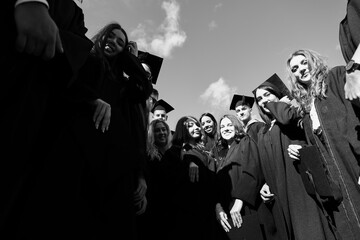 Group of diverse international graduating students celebrating