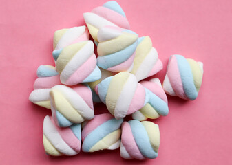 Marshmallow in pastel color - Top view on pink background