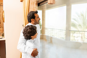 Arabian father and son having a talk at home