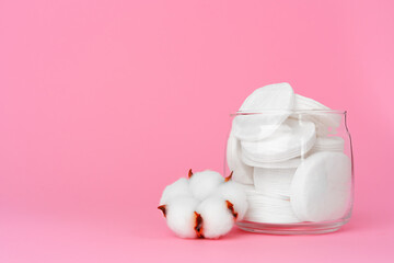 Cotton discs for skincare in a jar on paper background