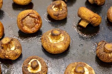 Baked mushrooms champignons in the oven.