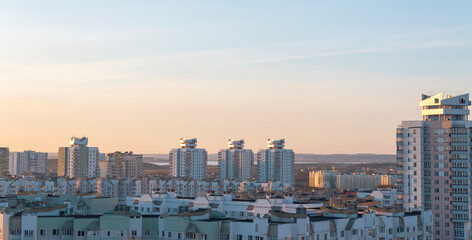 Fototapeta na wymiar Minsk roofs of houses at sunset