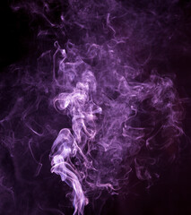 Purple smoke isolated on black background. Abstraction