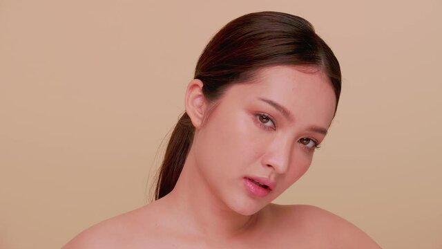 Beautiful face of Asian young woman with natural skin. Portrait of Beauty girl with soft make-up and perfect skin.