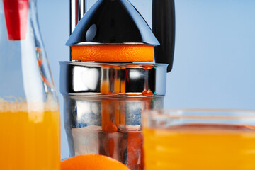 Metal hand orange juice squeezer close up