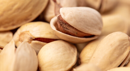 Close-up of fresh pistachio nuts as background.