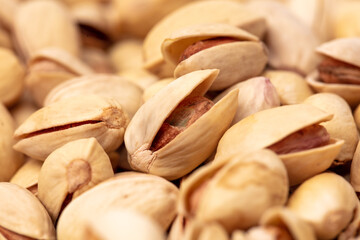 Close-up of fresh pistachio nuts as background.