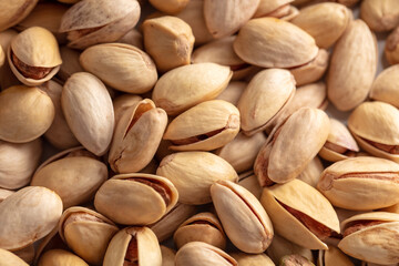 Close-up of fresh pistachio nuts as background.