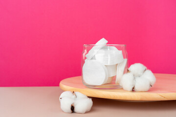 Cotton discs for skincare in a jar on paper background
