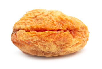 One dried apricot isolated on a white