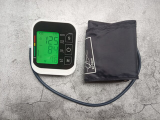 Flat Lay Photo, Digital Tensimeter or Blood Pressure Meter, with normal number indicator

