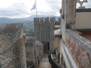 San Marino, the Walls. Closeup of the battlements of the walls that start from the castle and...
