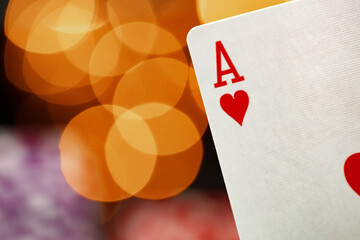 Playing cards against bokeh background close up